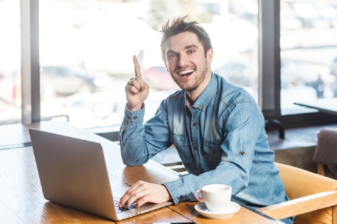 Portrait,Of,Excited,Overjoyed,Young,Man,Freelancer,In,Blue,Jeans