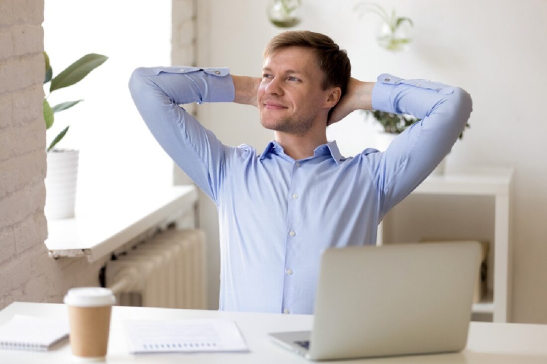 Satisfied,Businessman,Relaxing,Leaning,Back,With,Hands,Behind,Head,,Enjoying