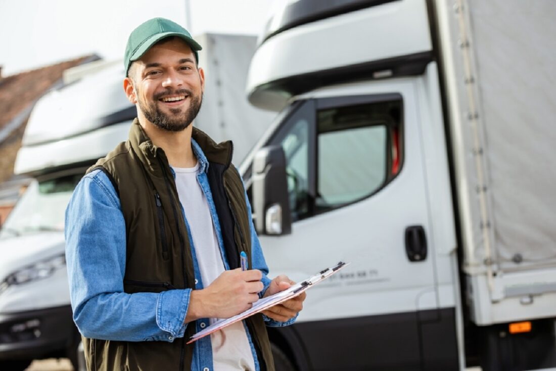 Happy,Confident,Male,Driver,Standing,In,Front,On,His,Truck