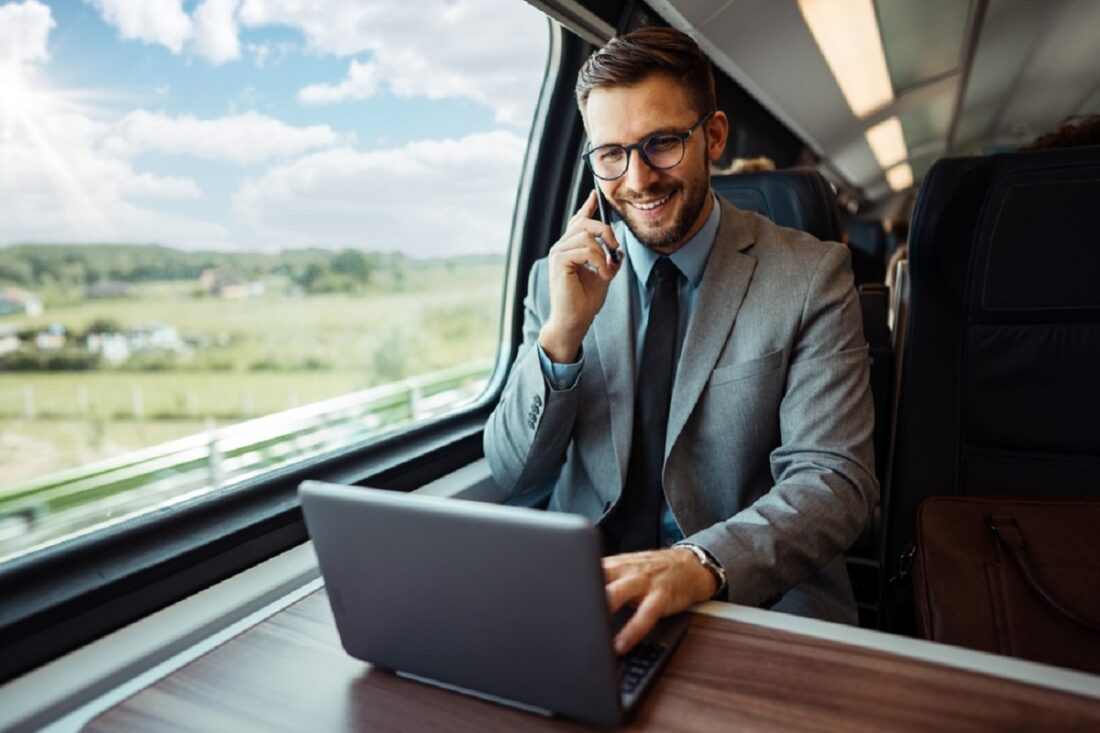 Handsome,Middle,Age,Businessman,Using,His,Laptop,Computer,While,Traveling