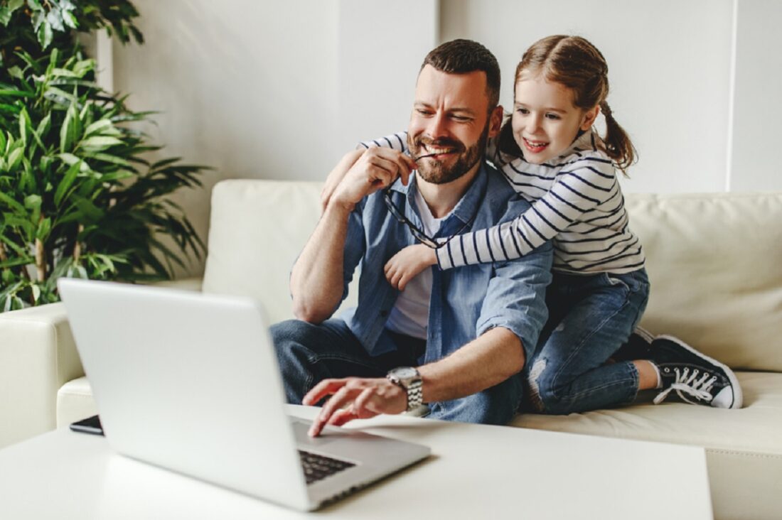 Happy,Family,A,Businessman,Father,Working,At,Computer,And,His