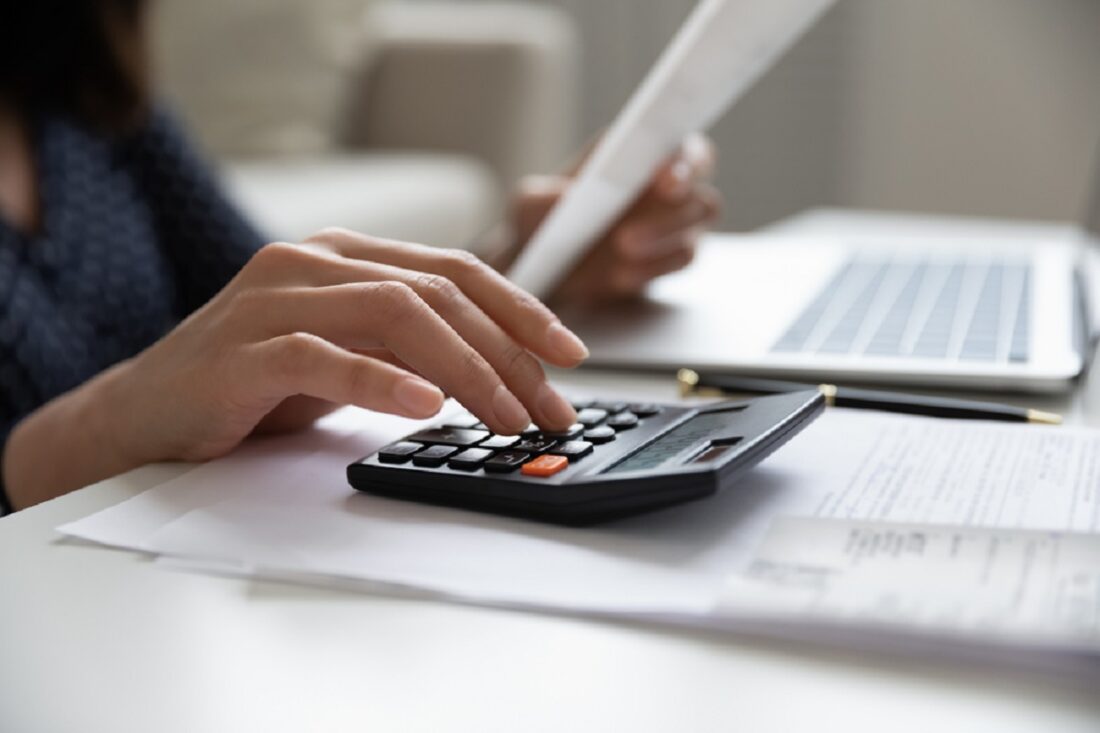 Close,Up,Young,Multiracial,Woman,Calculating,Domestic,Expenses,Involved,In