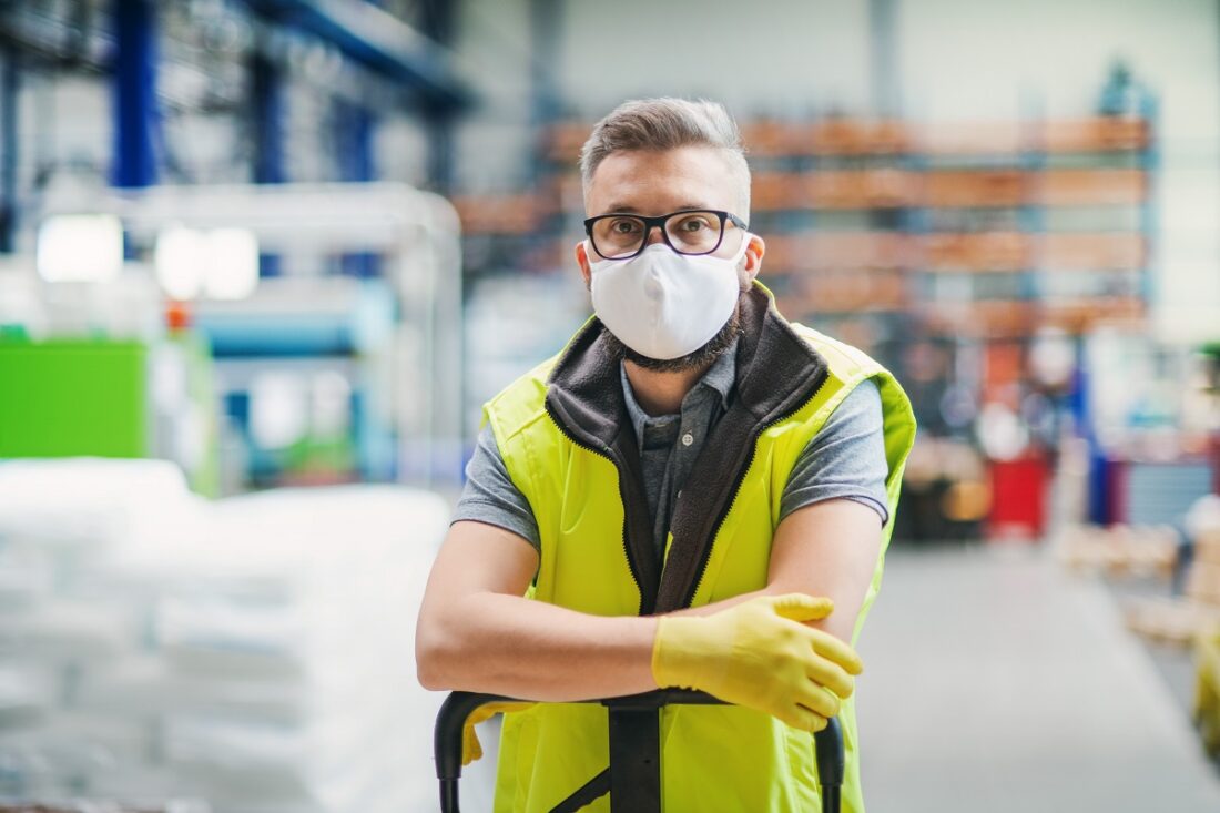 Man,Worker,With,Protective,Mask,Standing,In,Industrial,Factory,Or