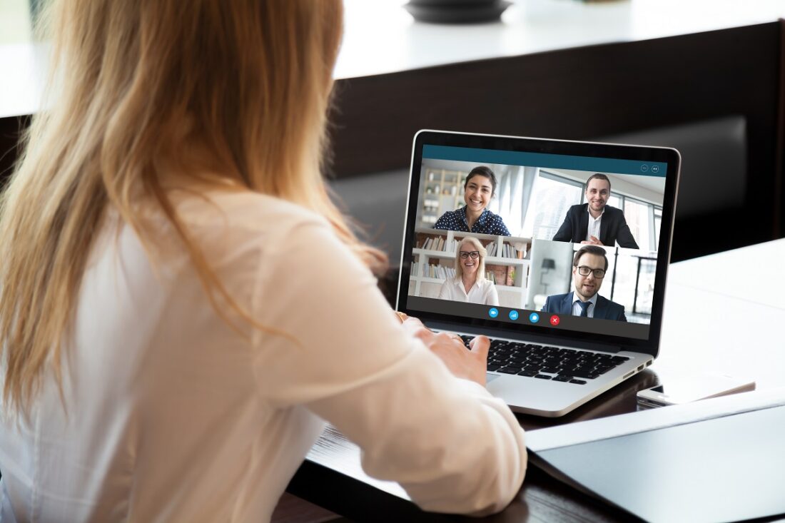 Back,View,Of,Businesswoman,Speak,Using,Webcam,Conference,On,Laptop