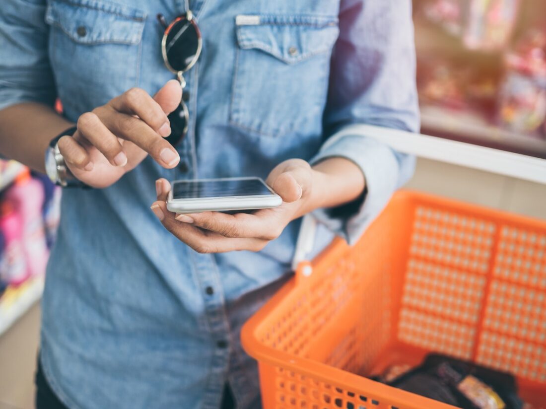 Woman,Wearing,Blue,Jeans,Shirt,And,Sunglasses,Using,Mobile,Phone