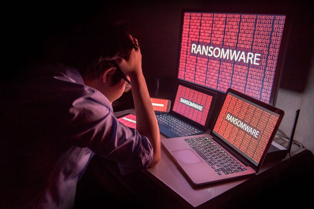 Young,Asian,Male,Frustrated,,Confused,And,Headache,By,Ransomware,Attack