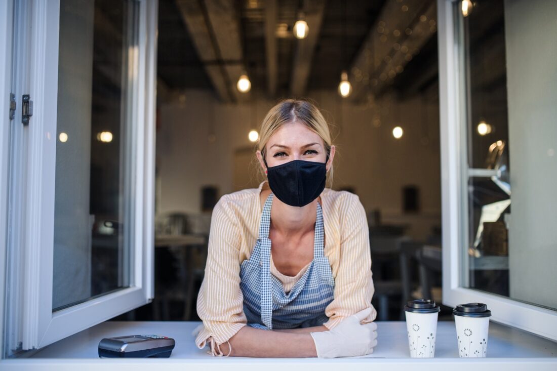 Woman,With,Face,Mask,Serving,Coffee,Through,Window,,Shop,Open