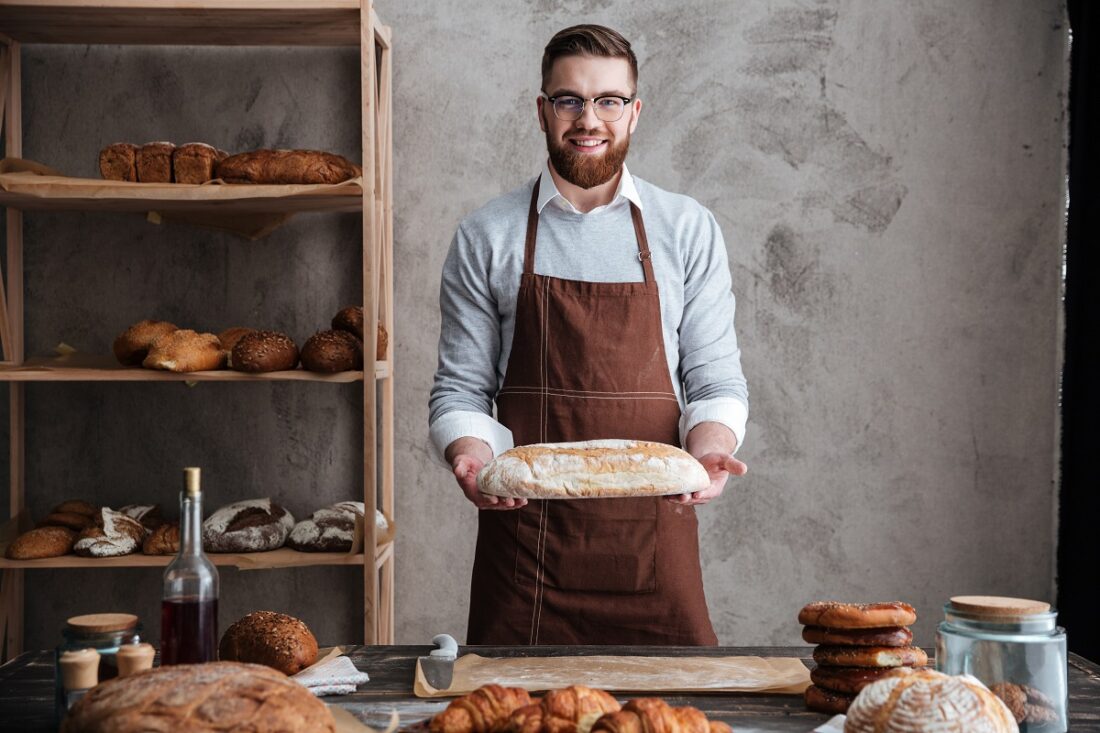 Image,Of,Cheerful,Young,Man,Baker,Standing,At,Bakery,Holding