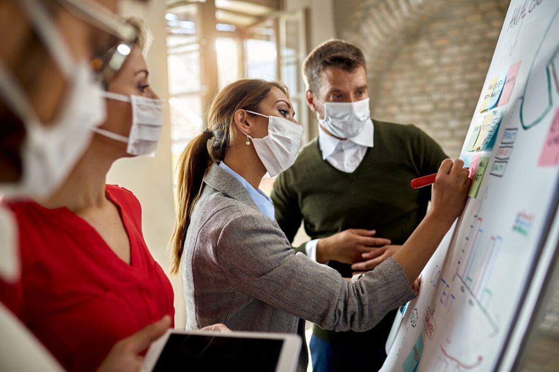 Young,Businesswoman,Wearing,Protective,Face,Mask,While,Writing,Mind,Map