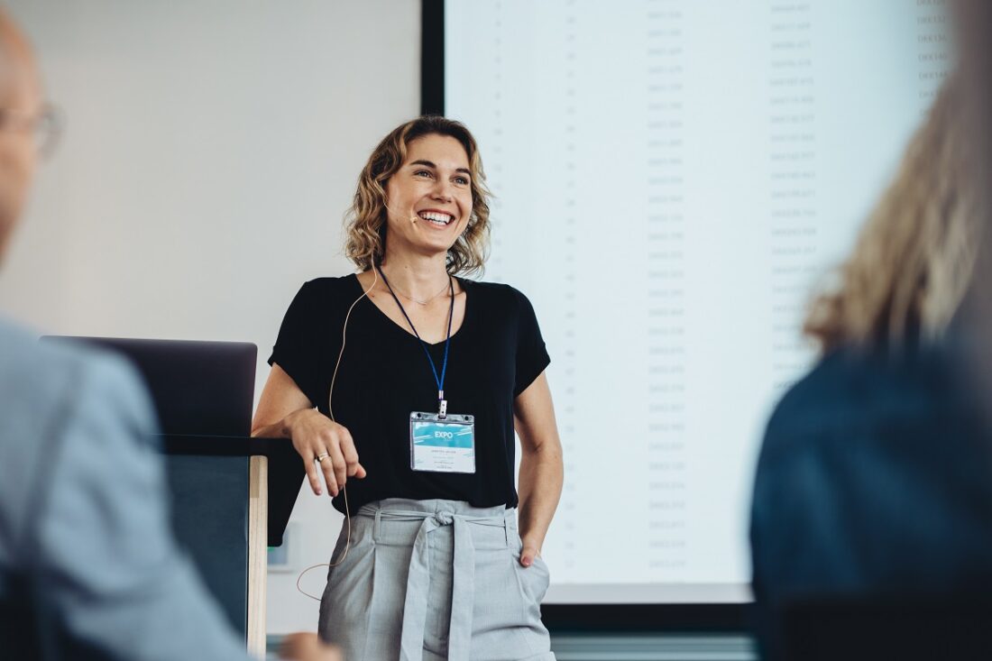 Smiling,Businesswoman,Delivering,A,Speech,During,A,Conference.,Successful,Business