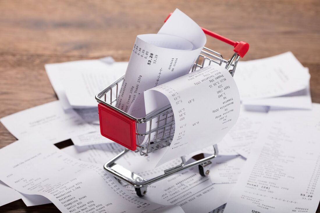 Close-up,Of,A,Shopping,Cart,With,Bunch,Of,Receipts,On