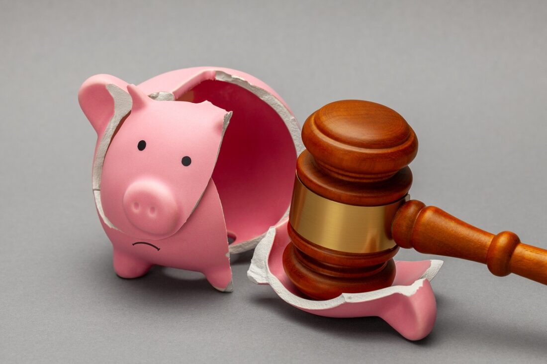 Broken,Piggy,Bank,And,Judge,Gavel,On,Gray,Background.,Bankruptcy,