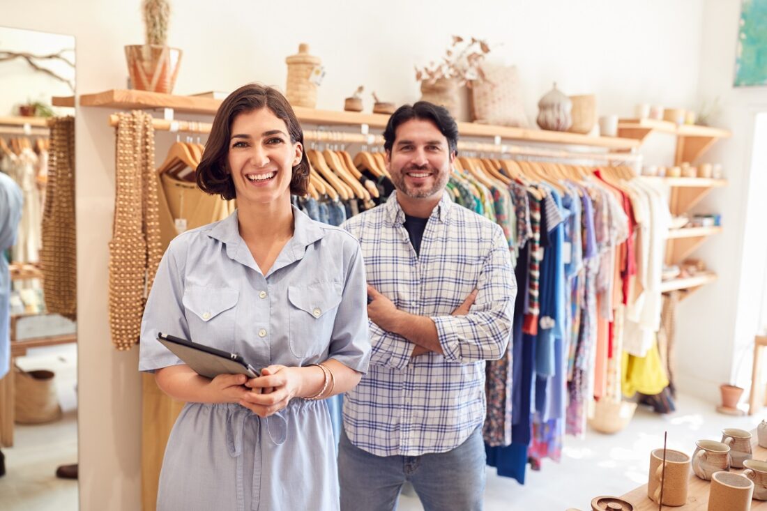 Portrait,Of,Male,And,Female,Owners,Of,Fashion,Store,Checking