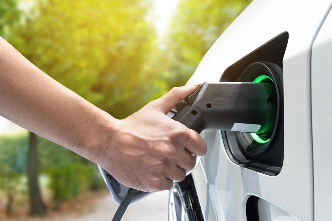 Electric,Vehicle,Charging,Station.,Hand,Charging,An,Electric,Car,(ev)