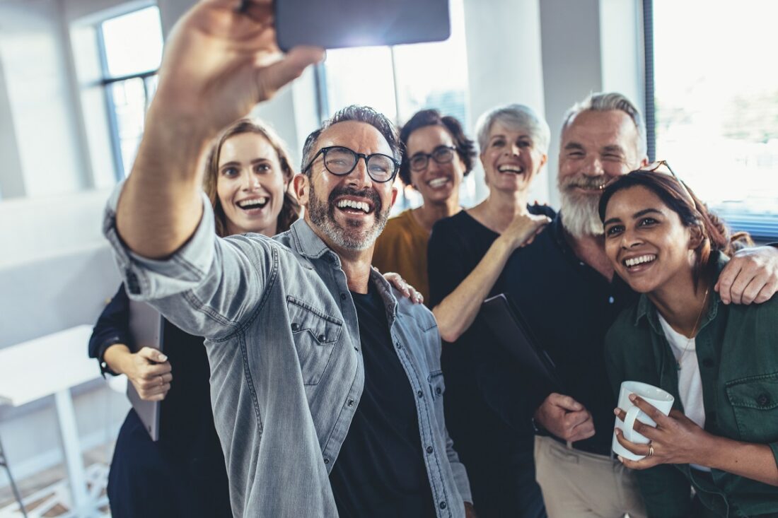 Business,People,Taking,Selfie,With,Phone,And,Smiling.,Successful,Business