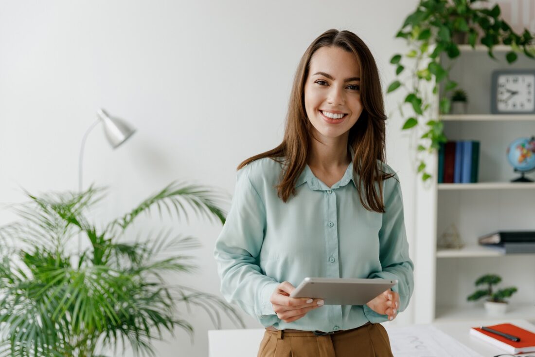 Young,Fun,Smiling,European,Successful,Employee,Business,Woman,In,Blue