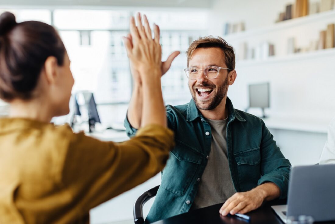 Successful,Business,People,Giving,Each,Other,A,High,Five,In