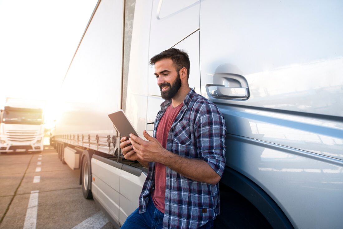 Professional,Truck,Driver,Checking,His,Route,On,Tablet,Computer,And