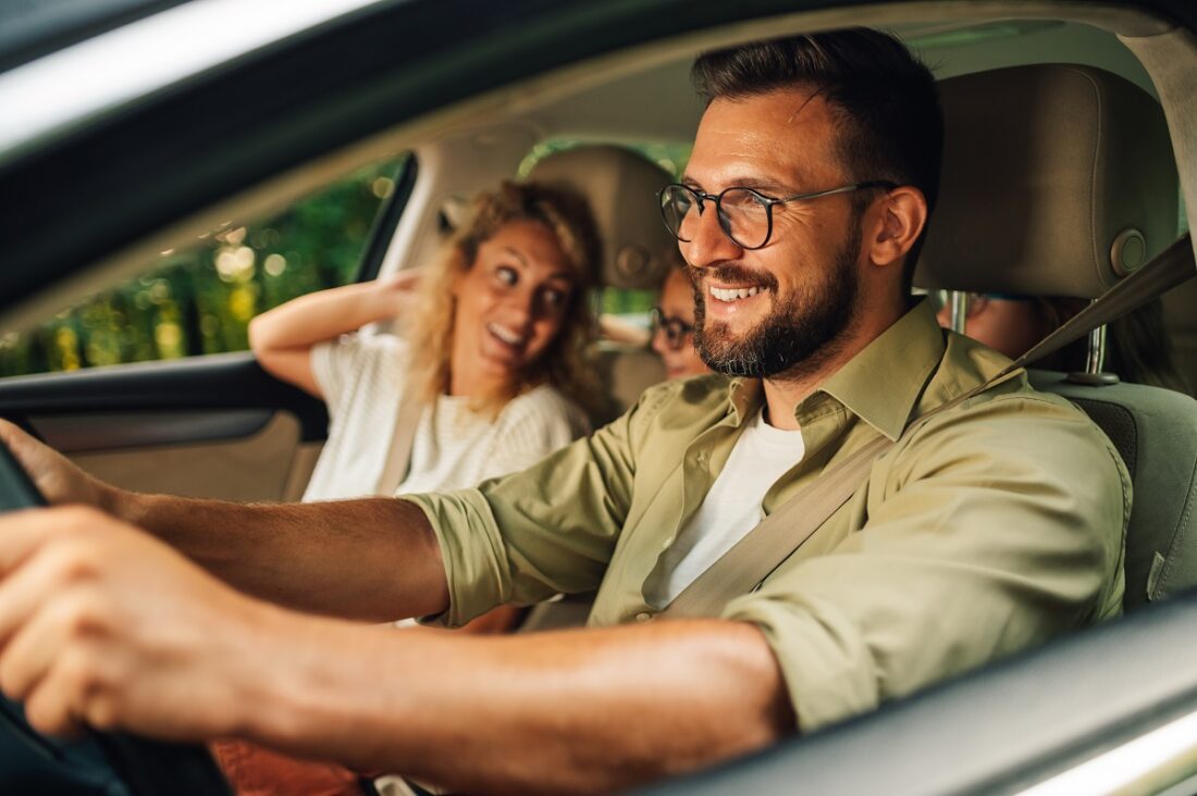 Close,Shot,Of,Father,Driving,A,Car,While,The,Whole