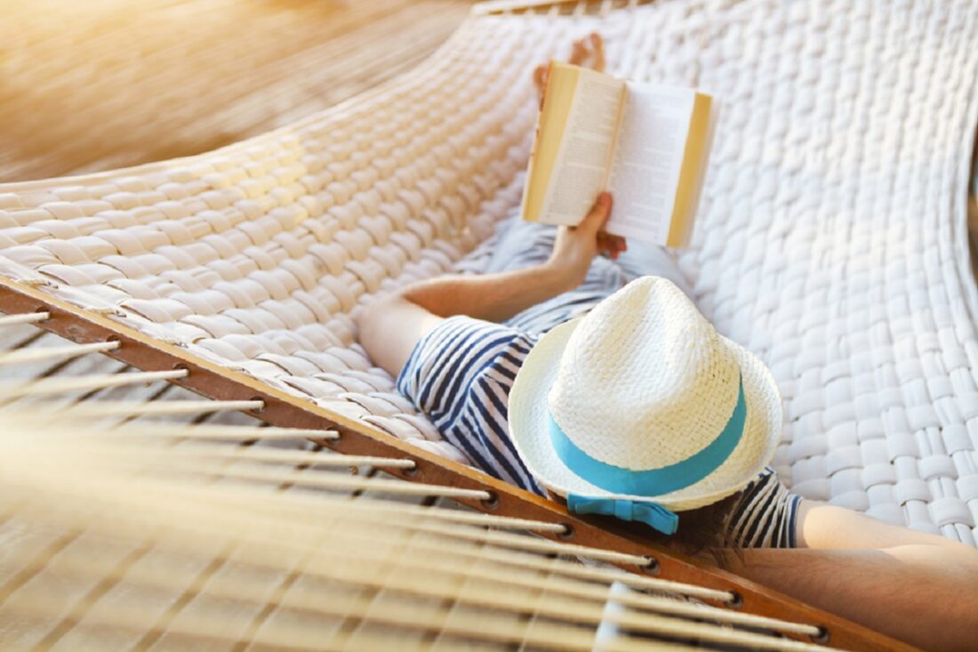 Lazy,Time.,Man,In,Hat,In,A,Hammock,With,Book