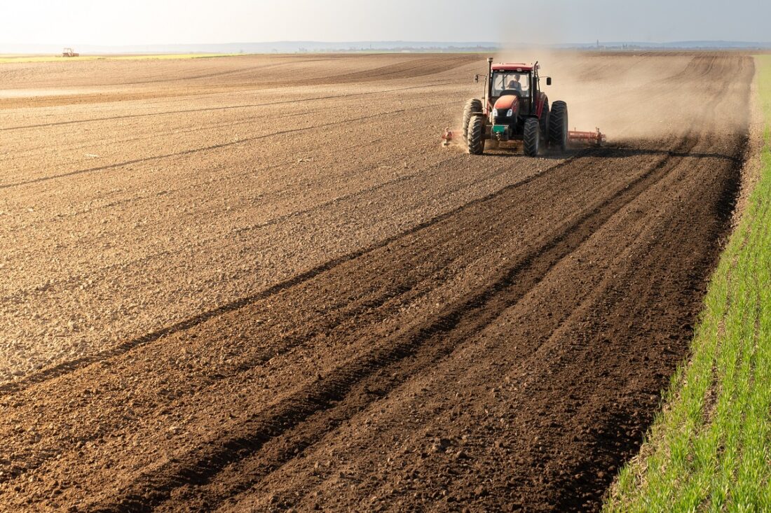 A,Farmer,On,A,Tractor,Processes,A,Farm,Field.,Preparing