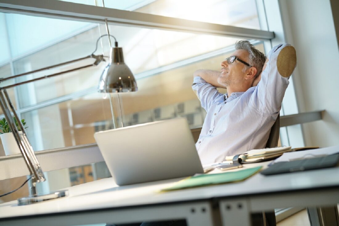 Businessman,In,Office,Relaxing,In,Desk,Chair