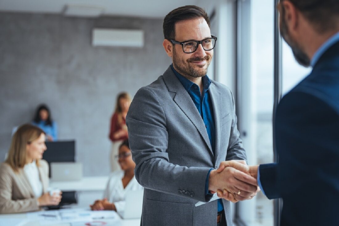 Portrait,Of,Cheerful,Young,Manager,Handshake,With,New,Employee.,Business