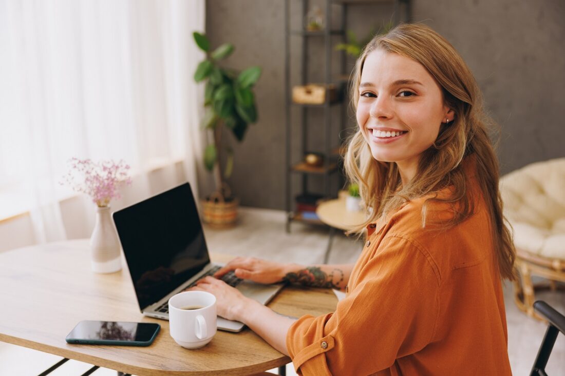 Sideways,Young,It,Woman,Wearing,Orange,Shirt,Hold,Use,Laptop